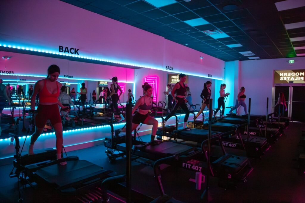 Pilates for Beginners class under purple light